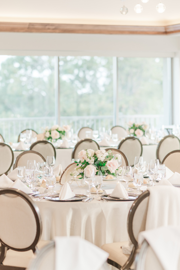 Details of a wedding reception with white flowers and centerpieces